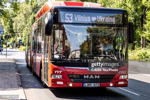 Public bus with a sign 'Vilnius loves Ukraine' drives on the street of the old town of Vilnius, Lithuania on July 14, 2023. Vilnius held the 2023...