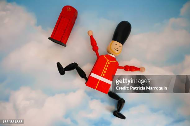 palace guard wooden toy and uk phone booth - queen's guard stock pictures, royalty-free photos & images