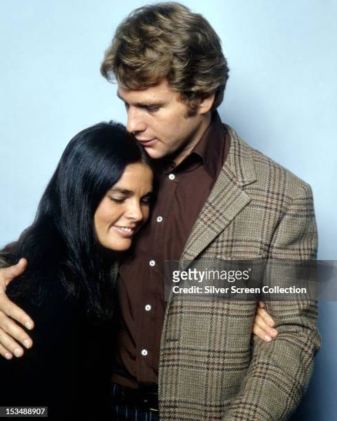 American actors Ryan O'Neal and Ali MacGraw in a promotional still for 'Love Story', directed by Arthur Hiller, 1970.