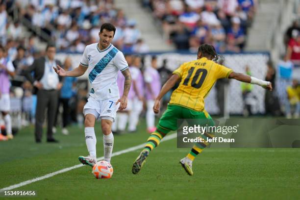 Aaron Herrera of Guatemala looks to pass against Bobby Decordova-Reid of Jamaica during a CONCACAF Gold Cup quarterfinal match at TQL Stadium on July...