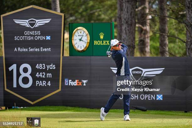 Rickie Fowler plays his shot from the 18th tee in front of the Rolex clock during the third round of the Genesis Scottish Open at The Renaissance...