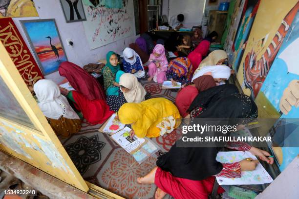 Afghan orphan girls attend a class in Jalalabad on July 16, 2023.