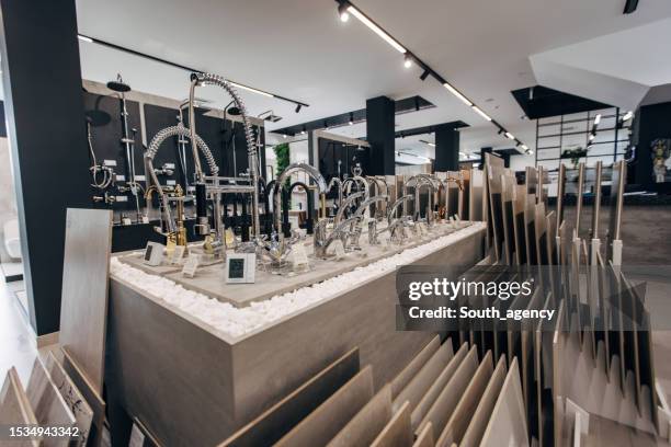 modern bathroom equipment in showroom - tile showroom stock pictures, royalty-free photos & images