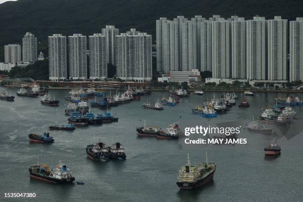 Boats are parked at a typhoon shelter in Tseun Wan as a precaution for the approaching Typhoon Talim in Hong Kong on July 16, 2023.