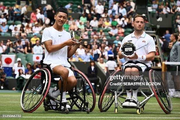 Japan's Tokito Oda holds the winner's trophy after beating Britain's Alfie Hewett during their men's wheelchair singles final tennis match on the...