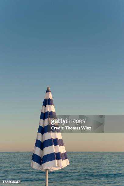 sun umbrella - beach umbrella stock pictures, royalty-free photos & images