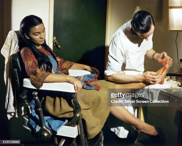 English actress Jean Simmons being made up for her role as the dancing girl Kanchi in 'Black Narcissus', directed by Michael Powell and Emeric...