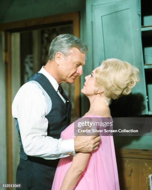 American actors Eddie Albert and Eva Gabor as Oliver Wendell Douglas and Lisa Douglas in the American TV comedy series 'Green Acres', circa 1968.