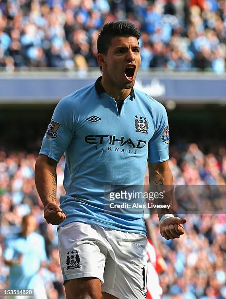 Sergio Aguero of Manchester City celebrates scoring his team's second goal during the Barclays Premier League match between Manchester City and...