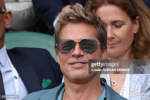 Actor Brad Pitt watches the men's singles final tennis match between Spain's Carlos Alcaraz and Serbia's Novak Djokovic on the last day of the 2023...