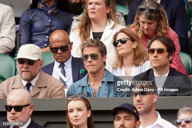 Brad Pitt and Guy Ritchie watching the Gentlemen's Singles final on day fourteen of the 2023 Wimbledon Championships at the All England Lawn Tennis...