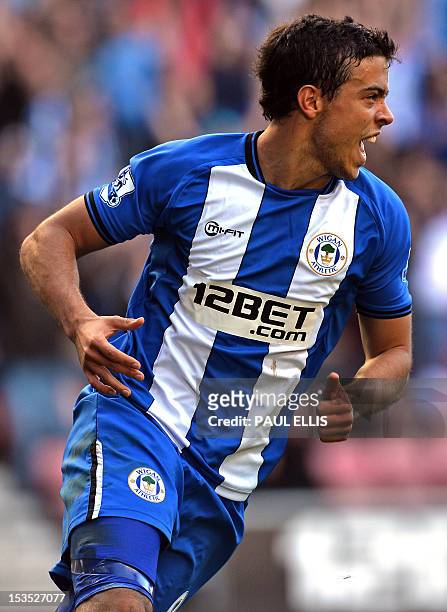 Wigan Athletic's Argentinian striker Franco Di Santo celebrates scoring their second goal during the English Premier League football match between...