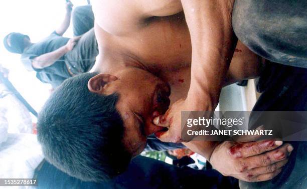 El activista del Partido Revolucionario Institucional , Jose Perez Gomez, aparece custodiado por militantes Zapatistas, luego que fuera golpeado al...