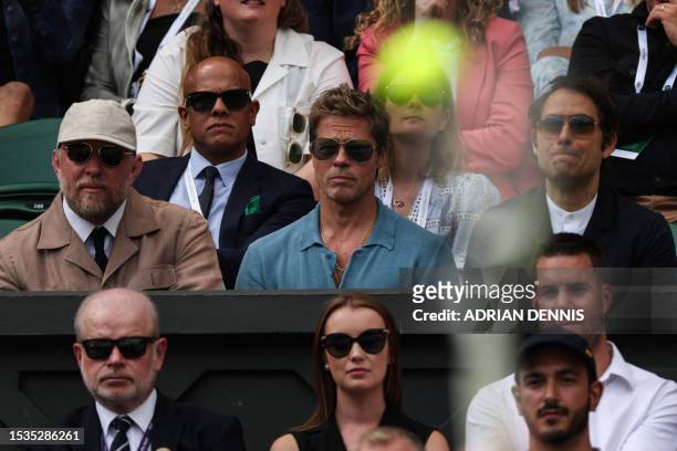 Actor Brad Pitt watches the men's singles final tennis match between Spain's Carlos Alcaraz and Serbia's Novak Djokovic on the last day of the 2023...