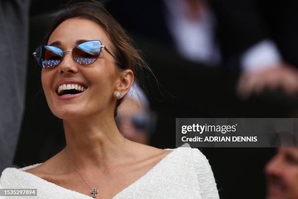 Serbia's Novak Djokovic's wife Jelena Ristic smiles as she watches her husband playing Spain's Carlos Alcaraz during their men's singles final tennis...
