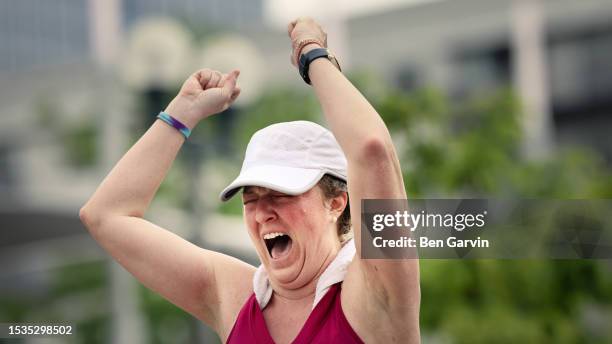 powerful marathon finish line celebration moment - exhausted at finish line stock pictures, royalty-free photos & images