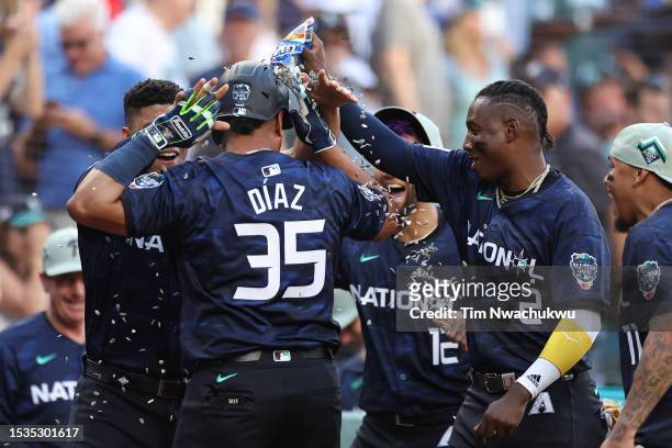 Elias Díaz of the Colorado Rockies celebrates with teammates after hitting a home run in the eight inning during the 93rd MLB All-Star Game presented...
