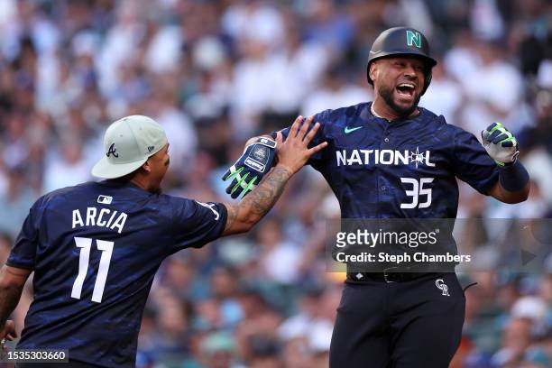 Elias Díaz of the Colorado Rockies with Orlando Arcia of the Atlanta Braves after hitting a home run in the eight inning during the 93rd MLB All-Star...