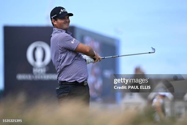 Golfer Patrick Reed watches his approach shot from the 5th fairway during a practice round ahead of the 151st British Open Golf Championship at Royal...