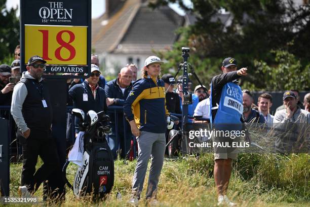 Australia's Cameron Smith and his caddie Sam Pinfold discuss tactics on the 18th tee during a practice round ahead of the 151st British Open Golf...