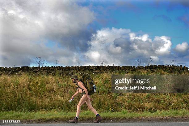 Stephen Gough the naked rambler makes his way south through Peebles in the Scottish Borders, following his release from Saughton Prison yesterday...