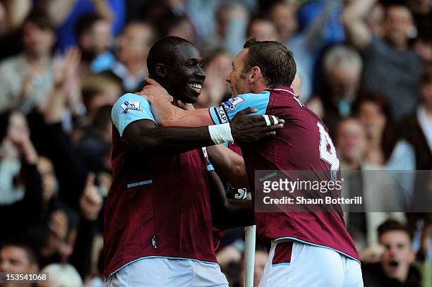 Mohamed Diame of West Ham is congratulated by teammate Kevin Nolan after scoring the opening goal during the Barclays Premier League match between...