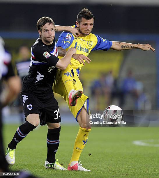 Ciryl Thereau of AC Chievo Verona and Jonathan Rossini of UC Sampdoria compete for the ball during the Seria A match between AC Chievo Verona and UC...