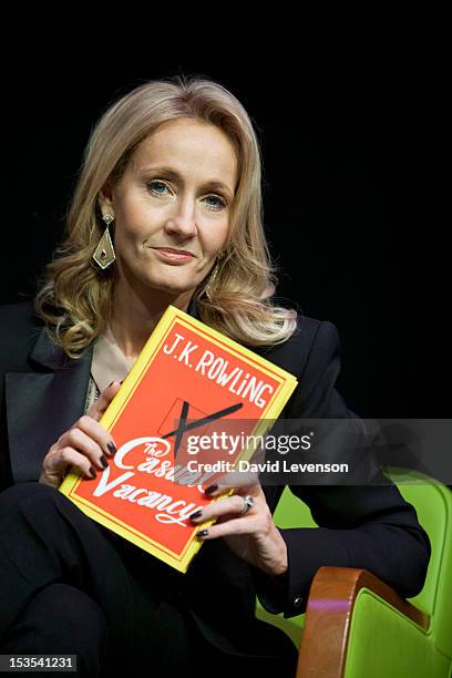 Rowling poses with her new book "The Casual Vacancy" on Day 2 of The Times Cheltenham Literature Festival on October 6, 2012 in Cheltenham, England.