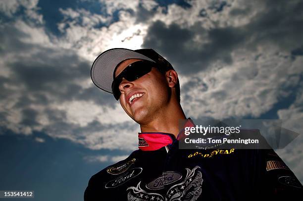 Trevor Bayne, driver of the Motorcraft/Quick Lane/Warriors in Pink Ford, stands on the grid after qualifying for the NASCAR Sprint Cup Series Good...