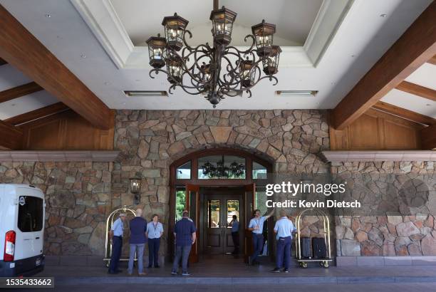 Bellhops wait for arrivals outside of the Sun Valley Lodge for the Allen & Company Sun Valley Conference on July 11, 2023 in Sun Valley, Idaho. Every...