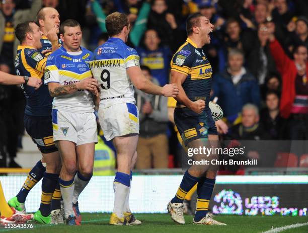 Ryan Hall of Leeds Rhinos celebrates scoring his team's fourth try during the Stobart Super League Grand Final between Warrington Wolves and Leeds...