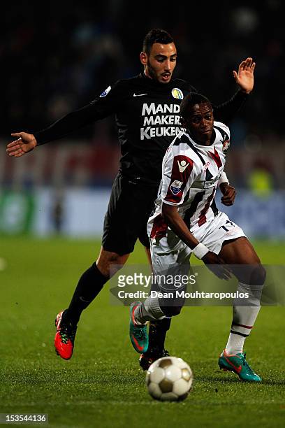 Virgil Misidjan of Willem II and Imad Najah of RKC battle for the ball during the Eredivisie match between Willem II Tilburg and RKC Waalwijk at the...