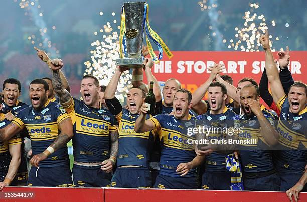 Kevin Sinfield of Leeds Rhinos lifts the trophy with his team mates following their victory at the end of the Stobart Super League Grand Final...