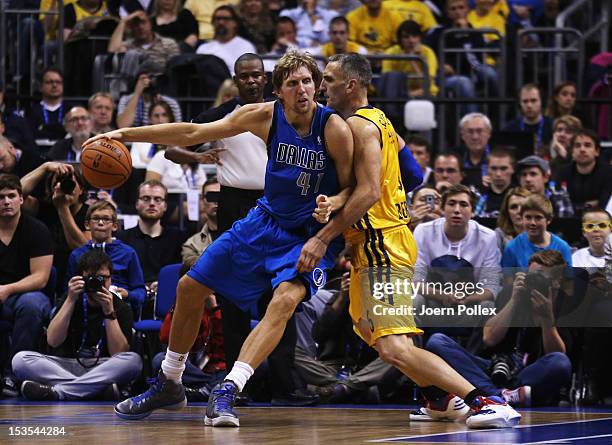 Dirk Nowitzki of Dallas is challenged by Sven Schultze of Berlin during the NBA Europe Live 2012 Tour match between Alba Berlin and Dallas Mavericks...