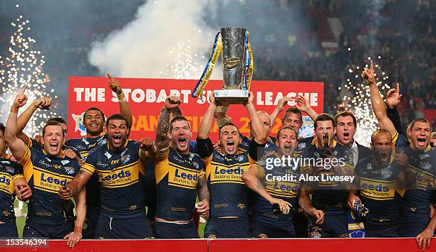 Kevin Sinfield of Leeds Rhinos lifts the trophy with his team mates following their victory at the end of the Stobart Super League Grand Final...