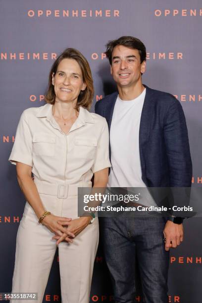 Claire Fournier and Julian Bugier attend the "Oppenheimer" premiere at Cinema Le Grand Rex on July 11, 2023 in Paris, France.