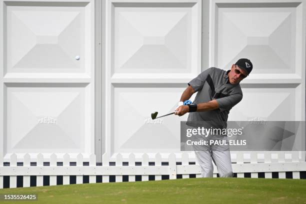 Golfer Phil Mickelson practices his chipping during practice ahead of the 151st British Open Golf Championship at Royal Liverpool Golf Course in...