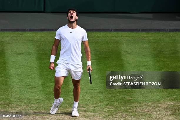 Spain's Carlos Alcaraz reacts to winning a point against Serbia's Novak Djokovic during their men's singles final tennis match on the last day of the...