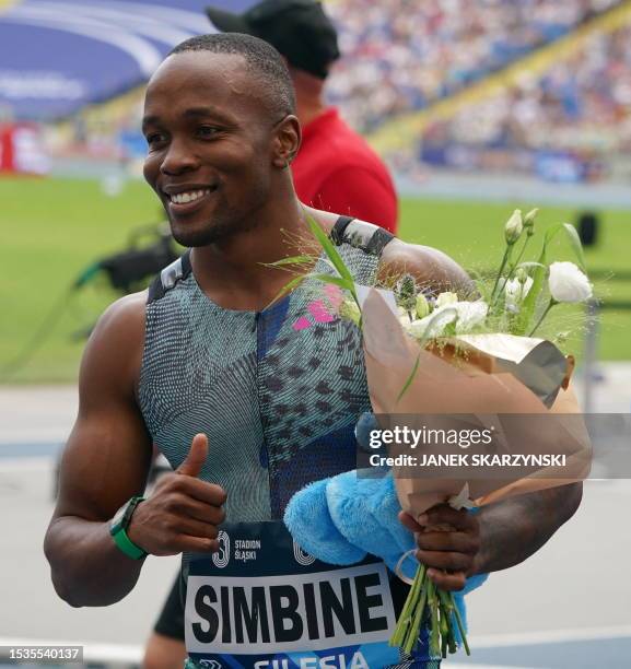 South Africa's Akani Simbine celebrates winning the men's 100M event of the Wanda Diamond League Silesia Kamila Skolimowska Memorial athletics...