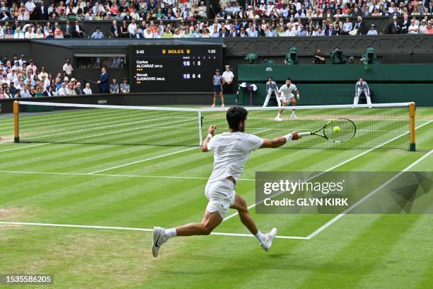 Spain's Carlos Alcaraz returns the ball to Serbia's Novak Djokovic during their men's singles final tennis match on the last day of the 2023...