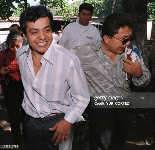 Former Salvadoran national guard Daniel Canales is accompanied by a relative 22 July shortly after being released from the local jail in...