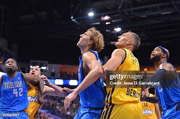 Dirk Nowitzki of the Dallas Mavericks is being guarded by Sven Schultze during the game between the Dallas Mavericks and the Alba Berlin at the O2...