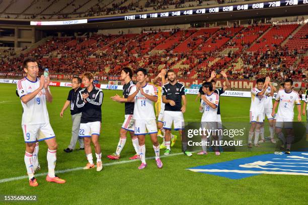 Tokyo players applaud fans after the 2-2 draw in the J.League J1 match between Kashima Antlers and FC Tokyo at Kashima Soccer Stadium on August 30,...