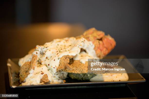 Menu item "The Boss" Seafood Stack prepared during the Madd Hatta live podcast show at The Greasy Spoon Soulfood Bistro on July 11, 2023 in Pearland,...