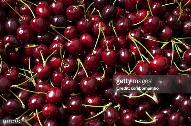 ripe cherry pile - black cherries stock pictures, royalty-free photos & images