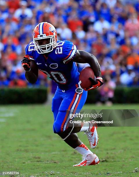 Omarius Hines of the Florida Gators runs for yardage during the game against the LSU Tigers at Ben Hill Griffin Stadium on October 6, 2012 in...