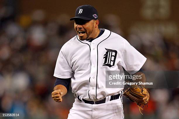 Joaquin Benoit of the Detroit Tigers reacts as he pitches in the eighth inning against the Oakland Athletics during Game One of the American League...