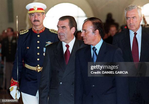 Chilean President Eduardo Frei shakes hands with Argentine President Carlos Menem after signing a bilateral agreement in Buenos Aires. Los...