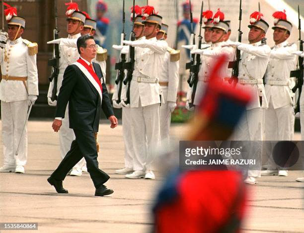 Peruvian president, Alberto Fujimori reviews Peruvian troops during military ceremony in Lima, Peru 09 December. El presidente de Peru Alberto...