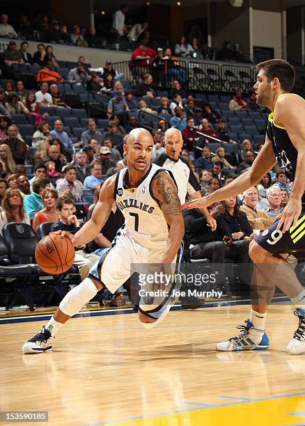 Jerryd Bayless of the Memphis Grizzlies drives against Felipe Reyes of Real Madrid on October 6, 2012 at FedExForum in Memphis, Tennessee. NOTE TO...